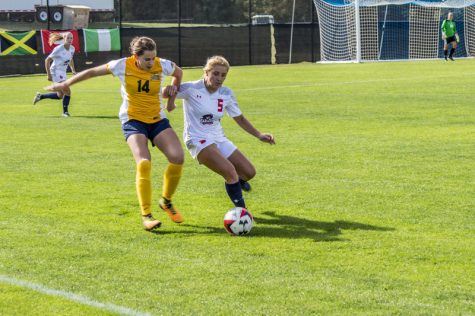 Taylor Burkley for the Colonials battles with Madeline Beaulieu during RMUs 1-0 loss