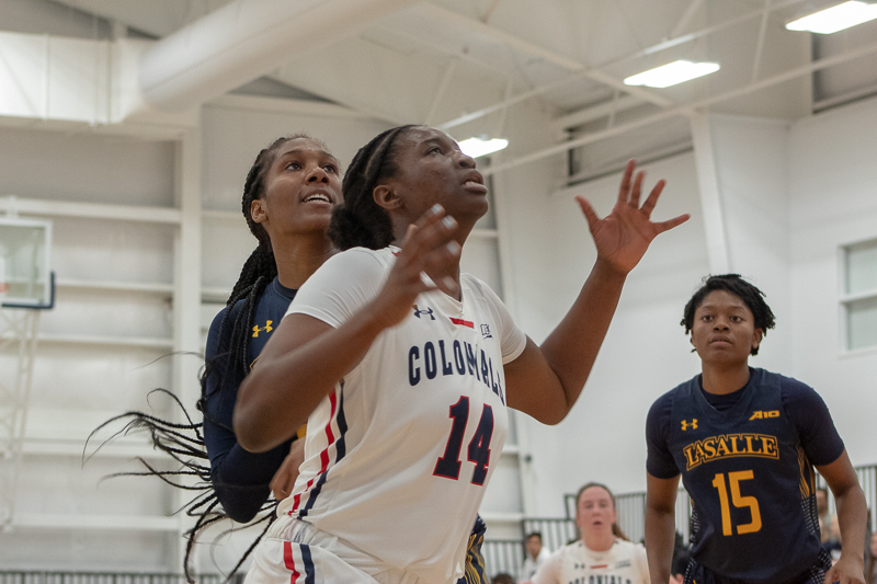 Irekpitan Ozzy-Momodu boxes out her opponent while attempting to get a rebound in the Colonials win against La Salle.