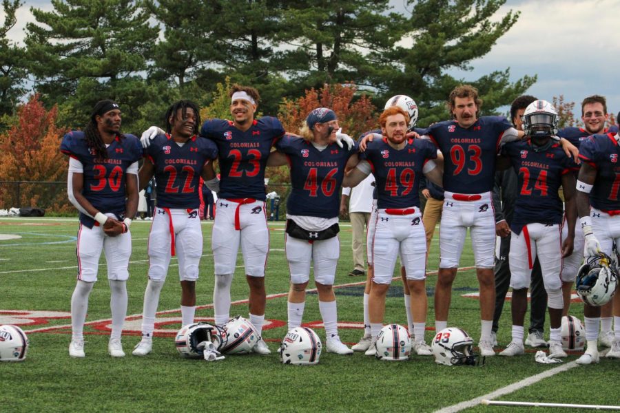 The+football+team+locks+arms+after+a+win+at+home+against+Howard.+Photo+credit%3A+Tyler+Gallo