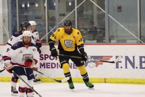 Former Steeler Brett Keisel skates against RMU alumni in the RMU Celebrity Hockey Game. Photo credit: Ethan Morrison