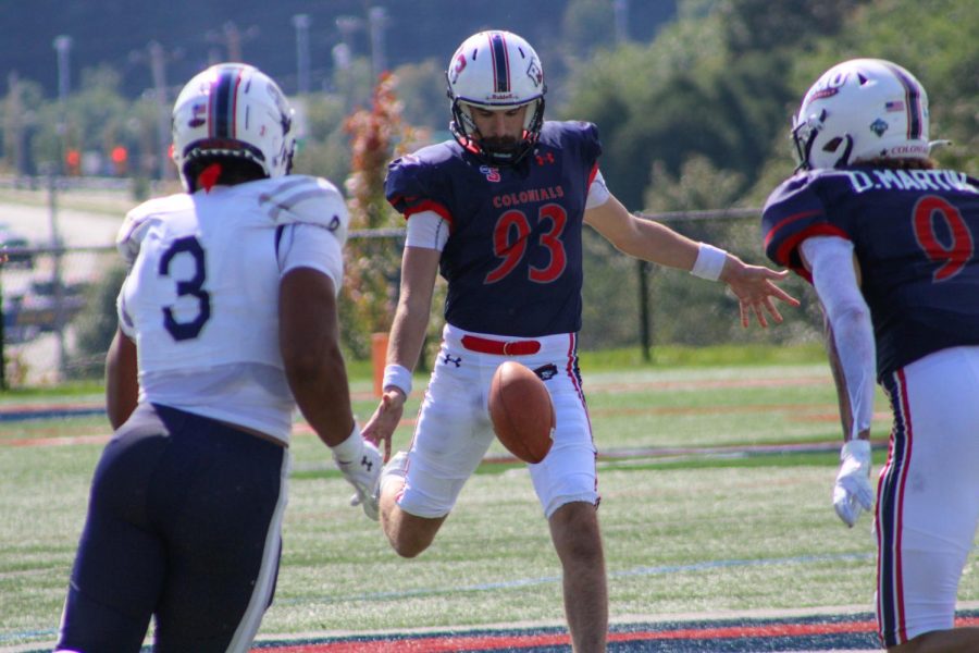 George Souders III and his glorious mustache punts the ball against Howard. Photo credit: Tyler Gallo