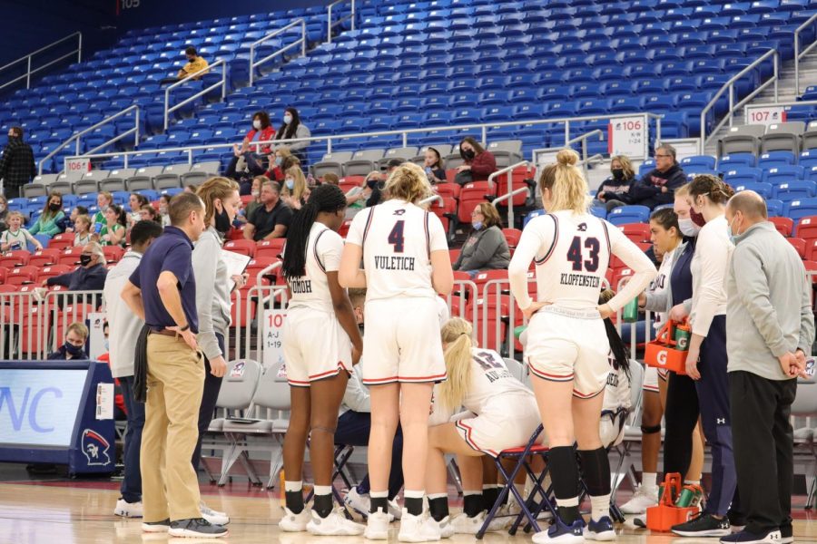 Women’s basketball gathers during their game against Cleveland State. Photo credit: Ethan Morrison