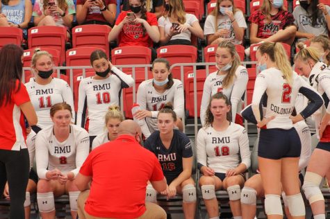 Volleyball meets with assistant (now head) coach Danny Doherty during a timeout against Duquesne. Photo credit: Tyler Gallo