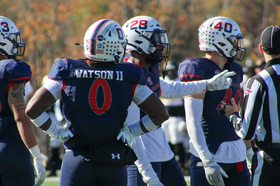 The RMU football defense meets before a snap against Kennesaw State. Photo credit: Tyler Gallo