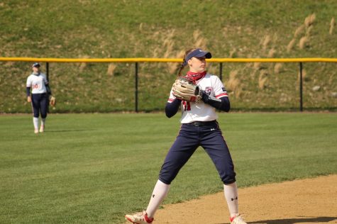 Charlotte Grover gets set to throw to first base. Photo credit: Ally Yovetich