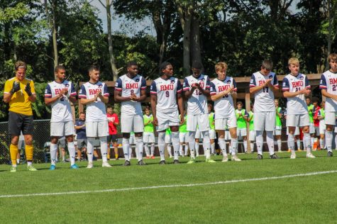 Mens soccer lines up for the national anthem before their game against Milwaukee. Photo credit: Tyler Gallo
