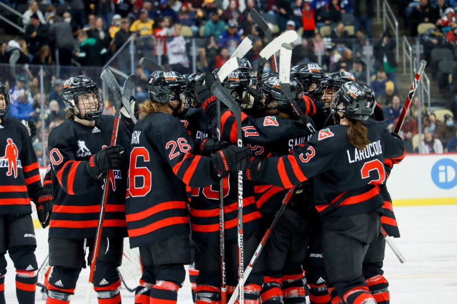 Team Canada celebrates their overtime goal. Photo Credit: Ethan Morrison