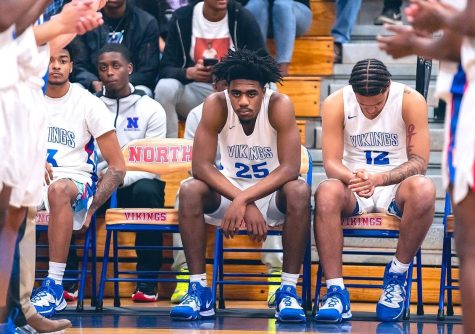 Ford (25) on the bench from his high school days for North Mecklenburg High School in North Carolina