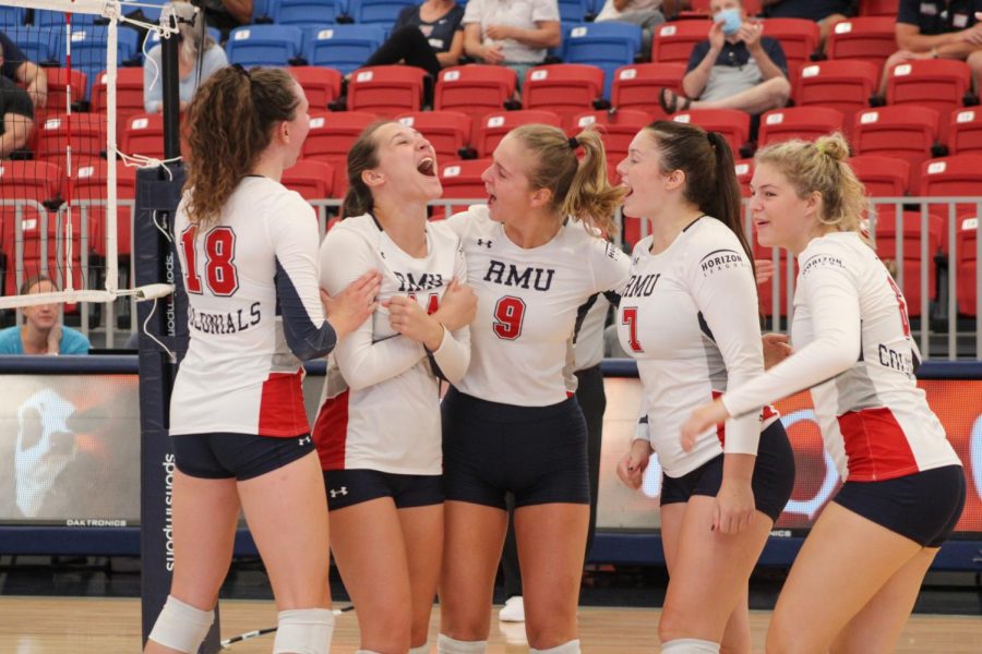 The team celebrates a point in their match against Duquesne on September 4, 2021 Photo credit: Tyler Gallo