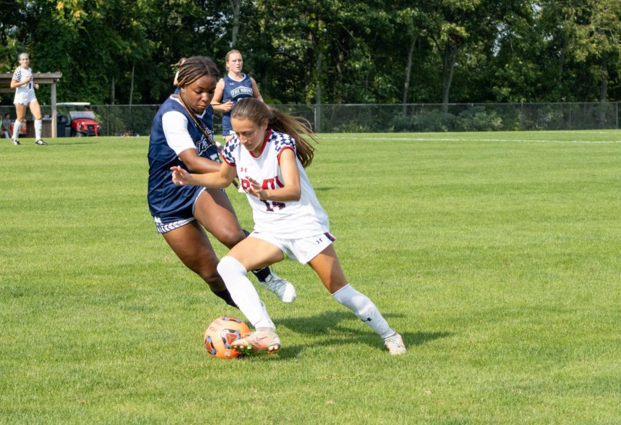 Malia Kearns attempts to dribble around a Mountaineer defender in their 1-1 draw on Thursday
