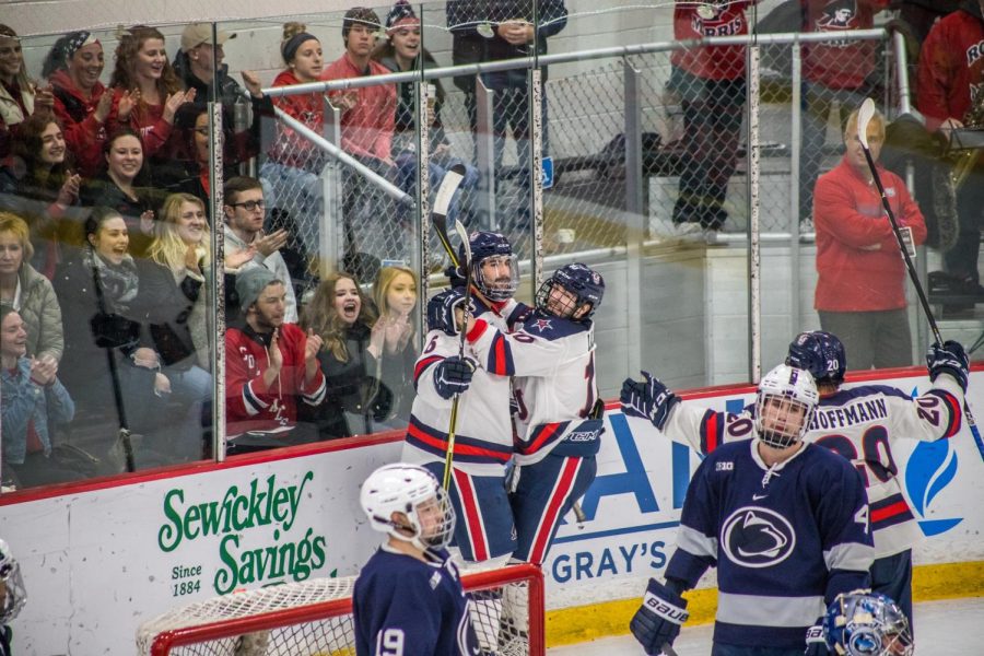 Mens hockey celebrates a goal against Penn State. Photo credit: David Auth