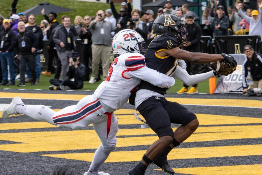 Deshaun Davis catches a 31-yard touchdown pass over Shakespeare Louis to open the scoring for Appalachian State Photo credit: Ethan Morrison