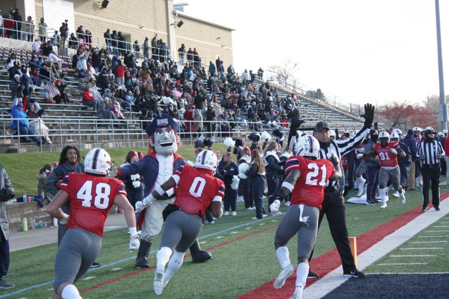 (left to right) Ethan Frenchik, Rico Watson and Sydney Audiger celebrate a big play on defense in the Senior Day loss to Bryant Photo credit: Alec Miller