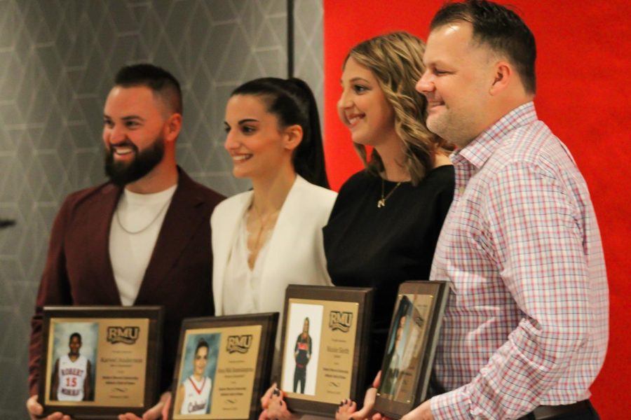 (left to right) Karvel Andersons childhood friend Jeremy Miller, Anna Niki Stamolamprou, Nicole Sleith and Ken Meases son Kert accept the RMU Athletics Hall of Fame honors Photo credit: Samantha Dutch