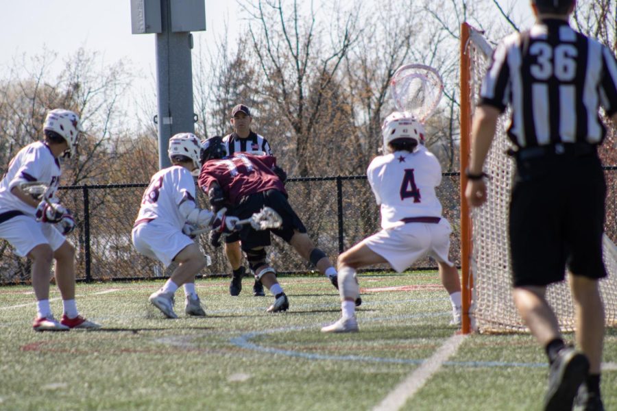 Nate Randall (4) had eight saves in the win over Bellarmine Photo credit: Hope Beatty