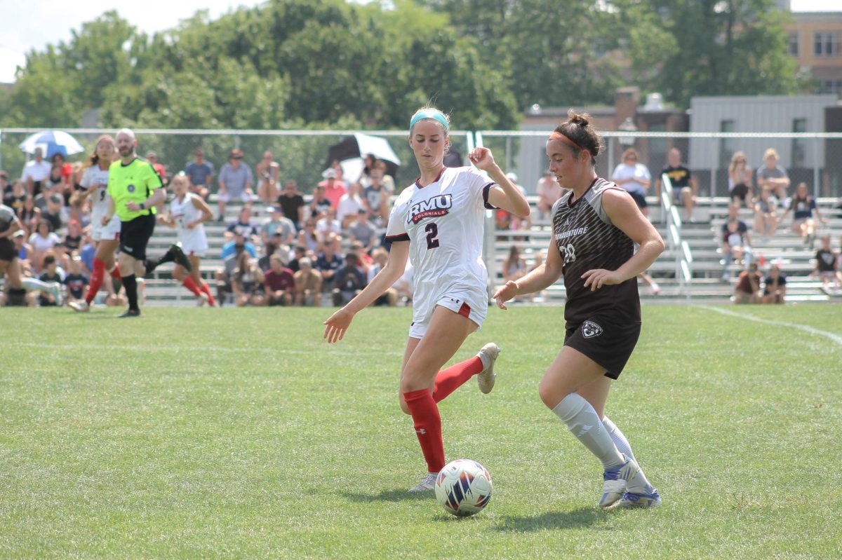 Taylor Day (2) attempts to tackle Lydia Choban (29) in Robert Morris draw against St. Bonaventure