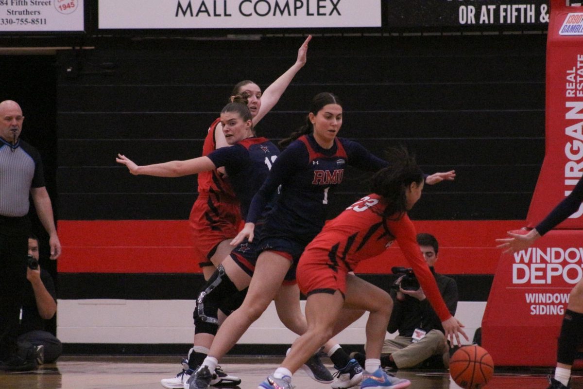 #1 Tuana Coskun and #12 Paris Kirk defend the paint in the Colonials 71-46 loss to Youngstown State Penguins